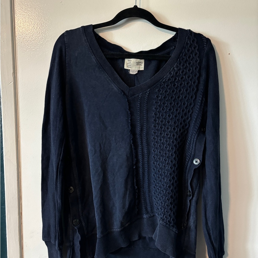 Blue V-Neck Sweater with Intricate Knit Pattern